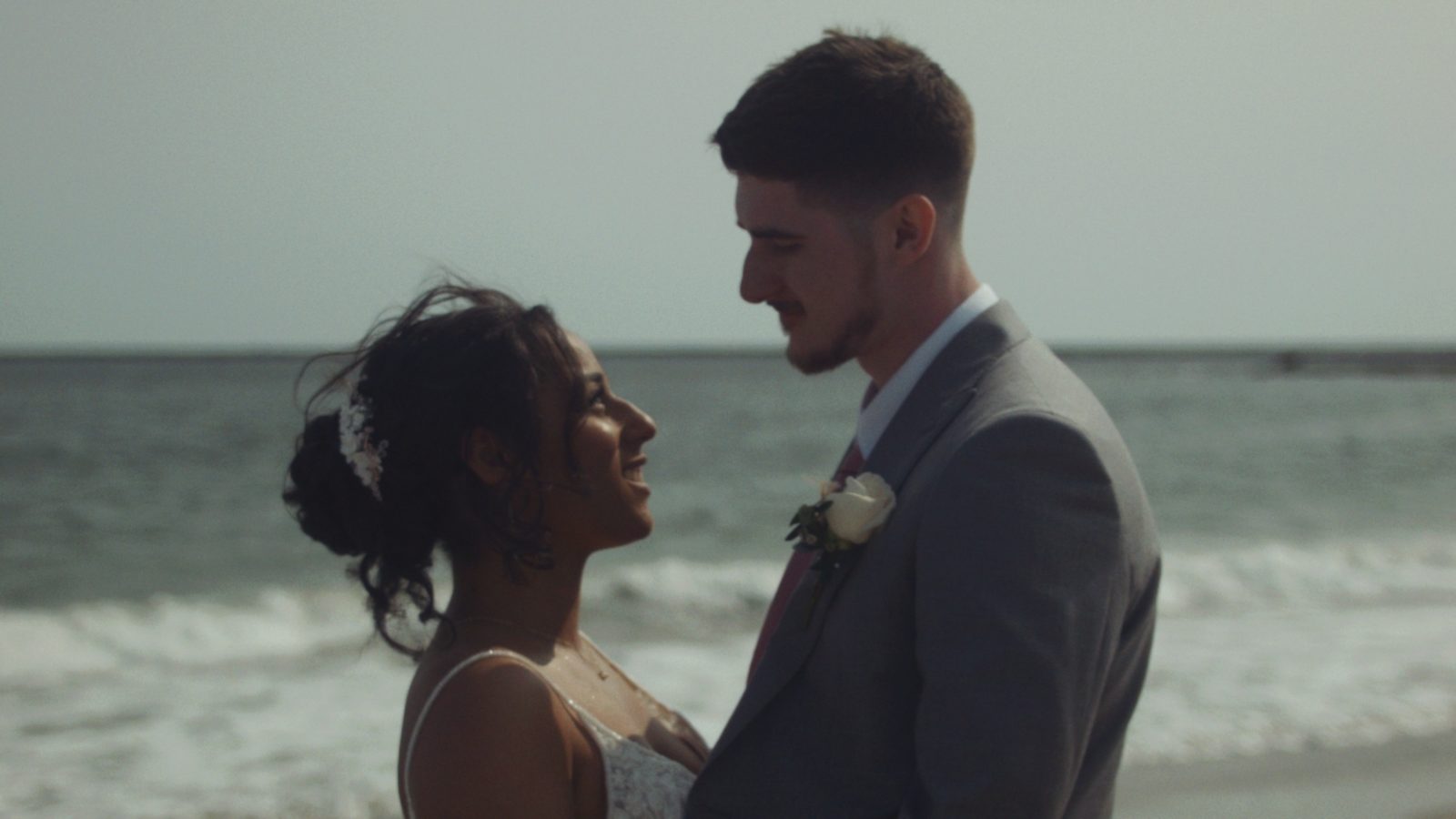 Couple on beach at golden hour