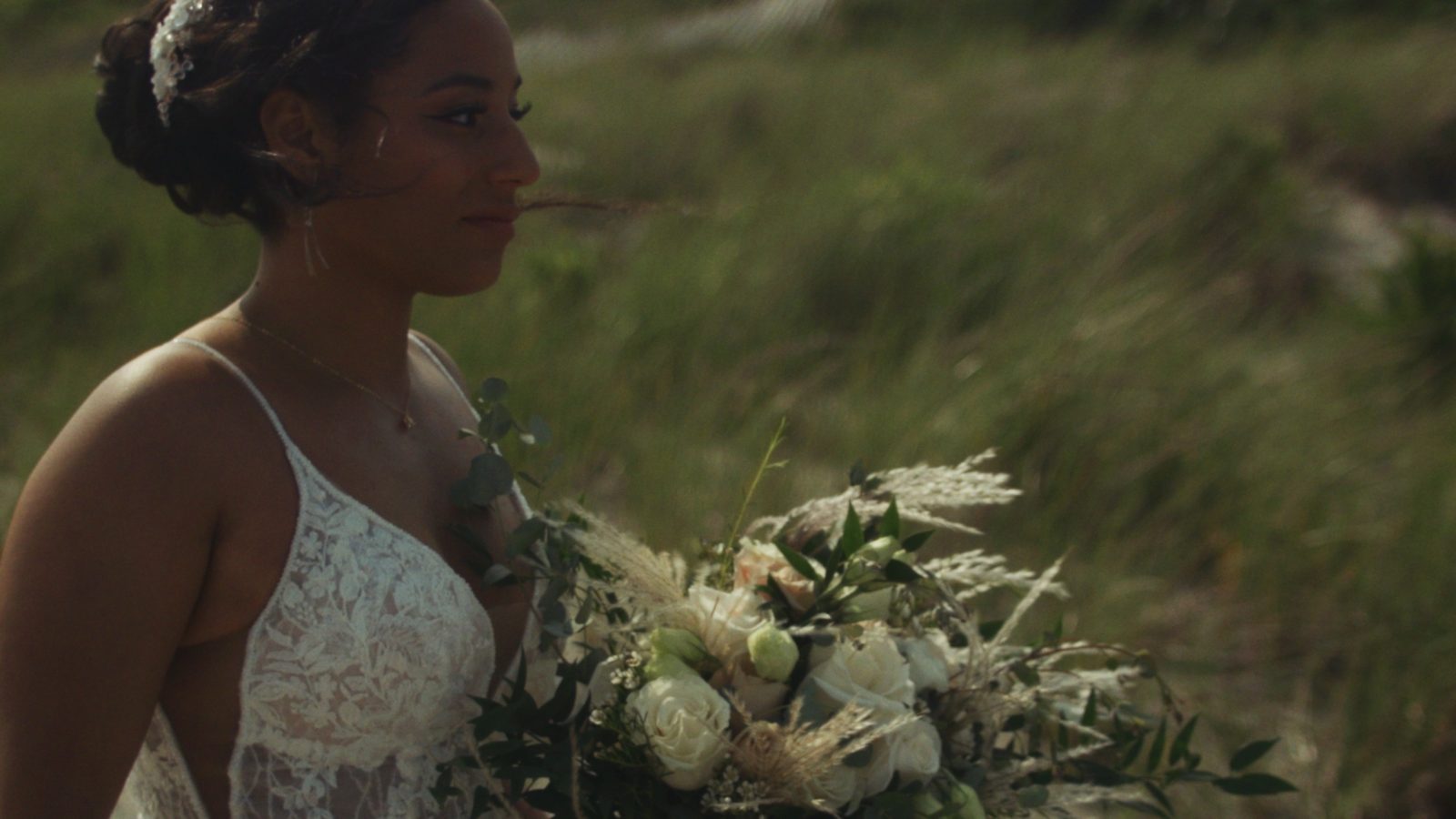 Bride with bouquet in golden field