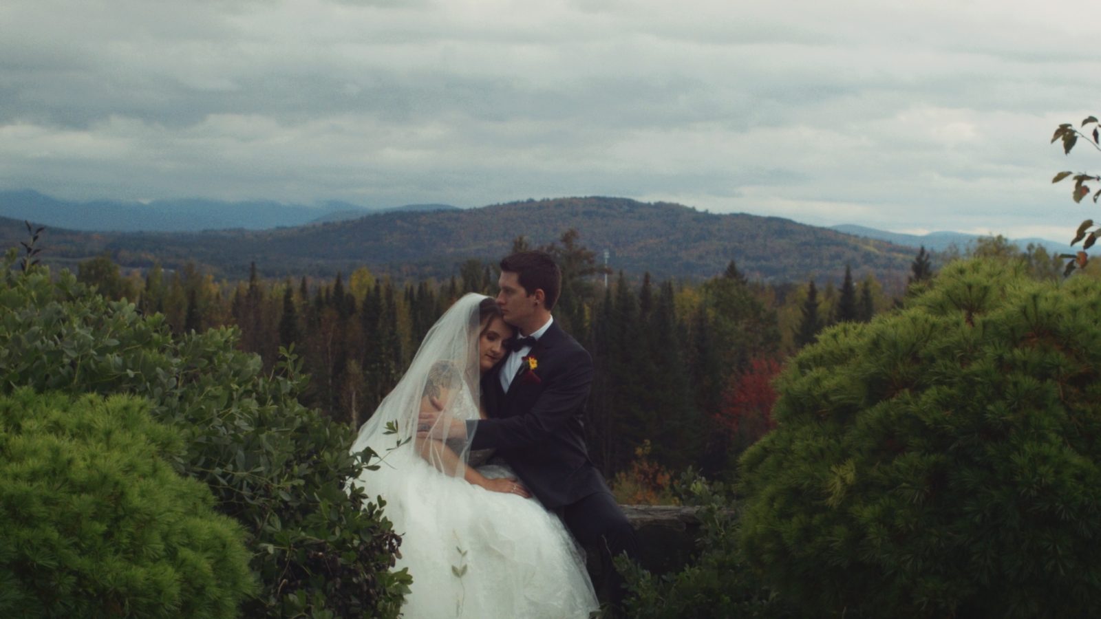 Couple embracing with mountain vista