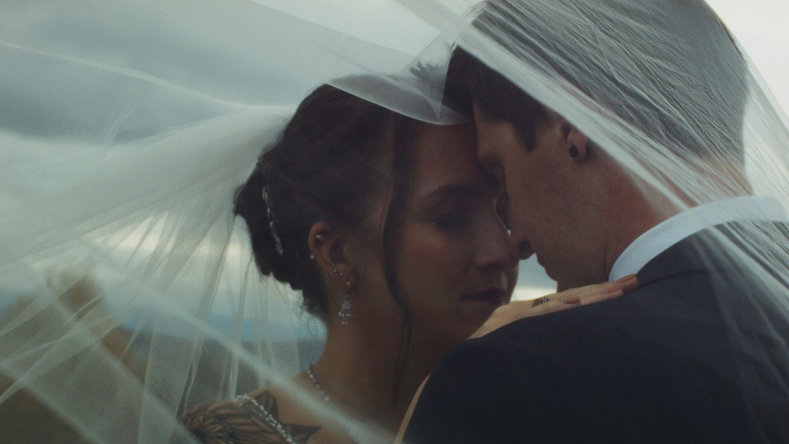 Intimate moment under veil